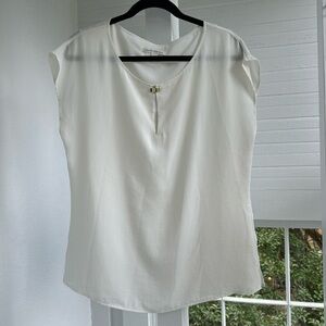 Banana Republic cream colored lined blouse with gold colored clasp, size 12